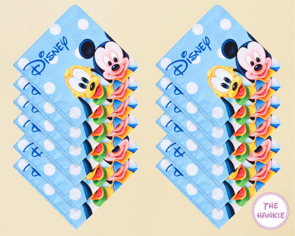 Two packages of Disney-themed tissues with cartoon characters on a beige background.