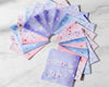 Set of colorful fabric swatches with floral patterns hankies on a white marble surface