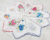 Set of floral embroidered handkerchiefs on a white background