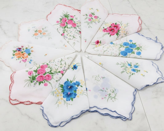 Set of floral embroidered handkerchiefs on a white background