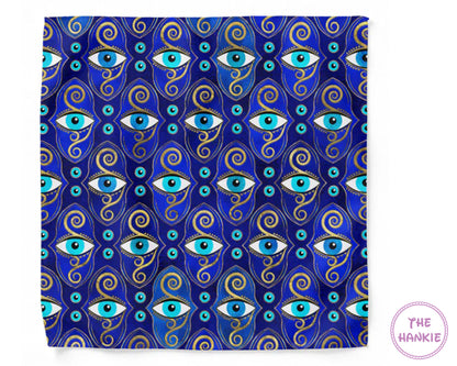Patterned product with blue eyes and swirls on a blue background, branded 'The Hankie'.