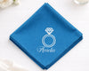 Blue hanky with a diamond ring design and 'Amelia' text on a white surface.