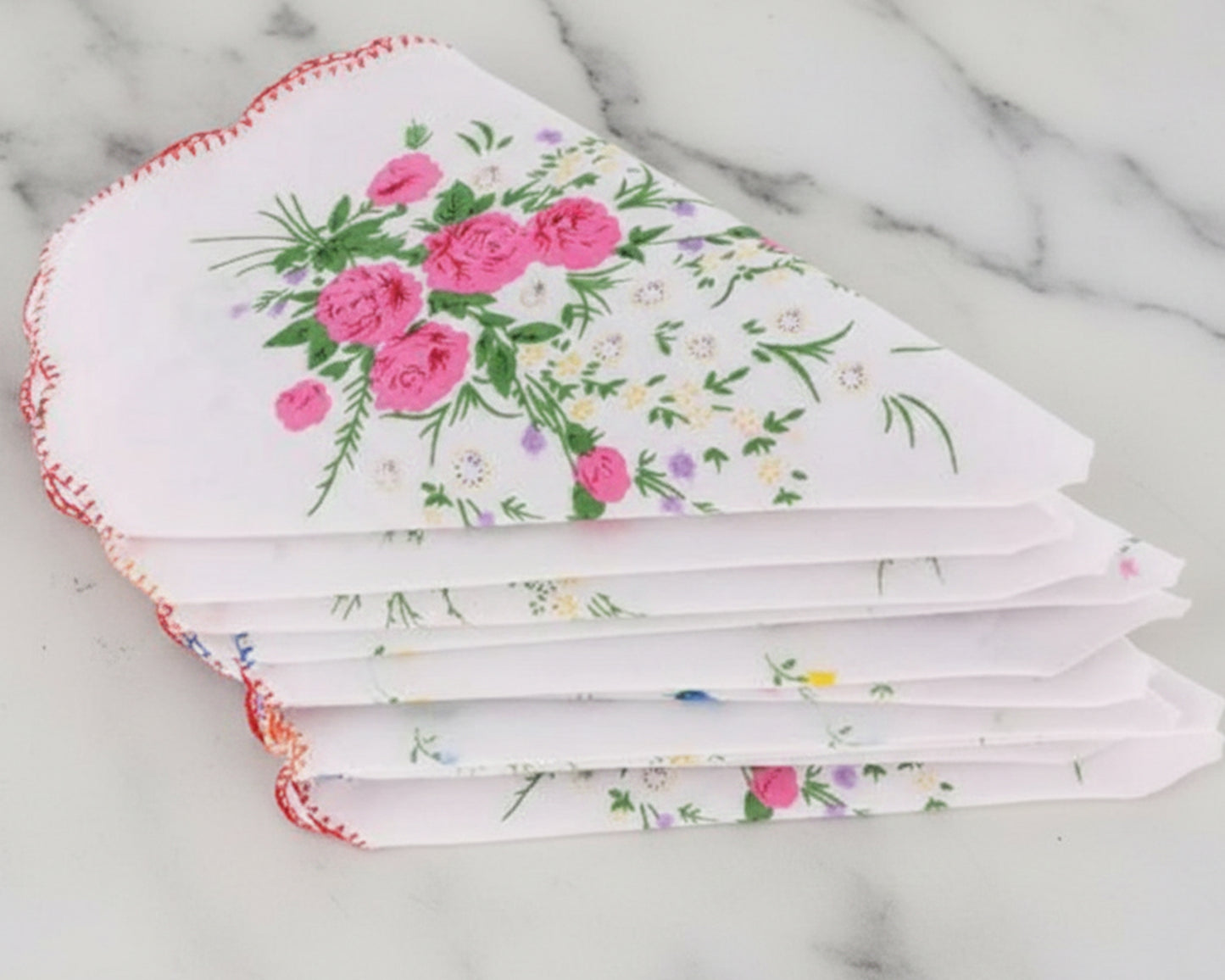 Set of floral handkerchiefs on a marble surface