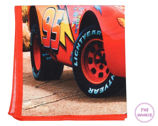 Folded towel with a cartoon car design featuring the number 95 and 'Lightyear' branding.