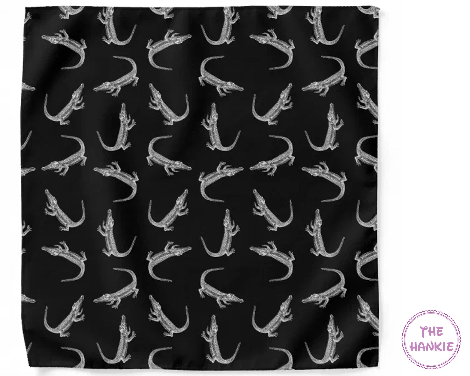 Black fabric with white crocodile pattern, branded 'The Hankie'.