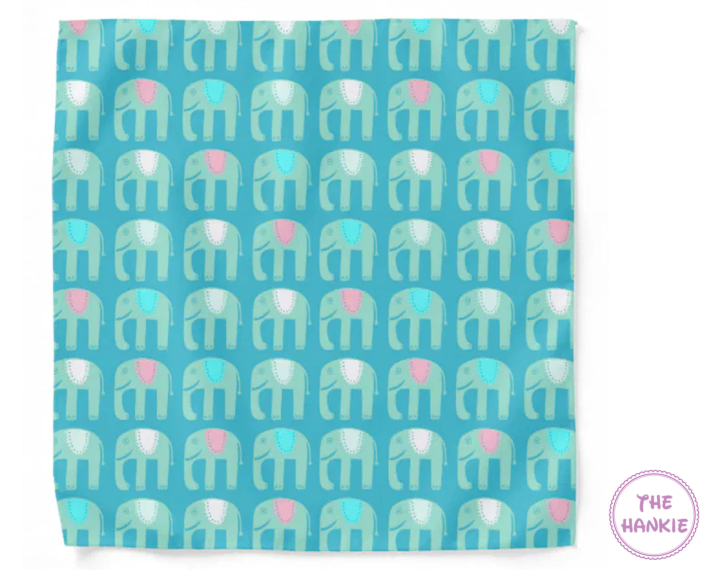 Patterned towel with elephant design on a blue background, featuring the brand 'The Hankie'.