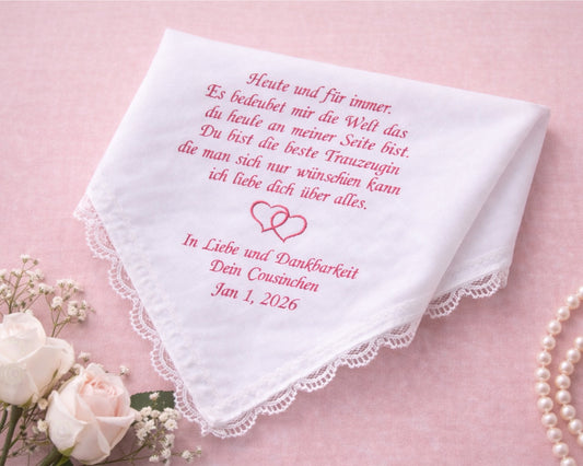 Embroidered handkerchief with romantic text on a pink background with flowers and pearls.