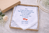 Embroidered handkerchief with a message and dates for mom on a light background