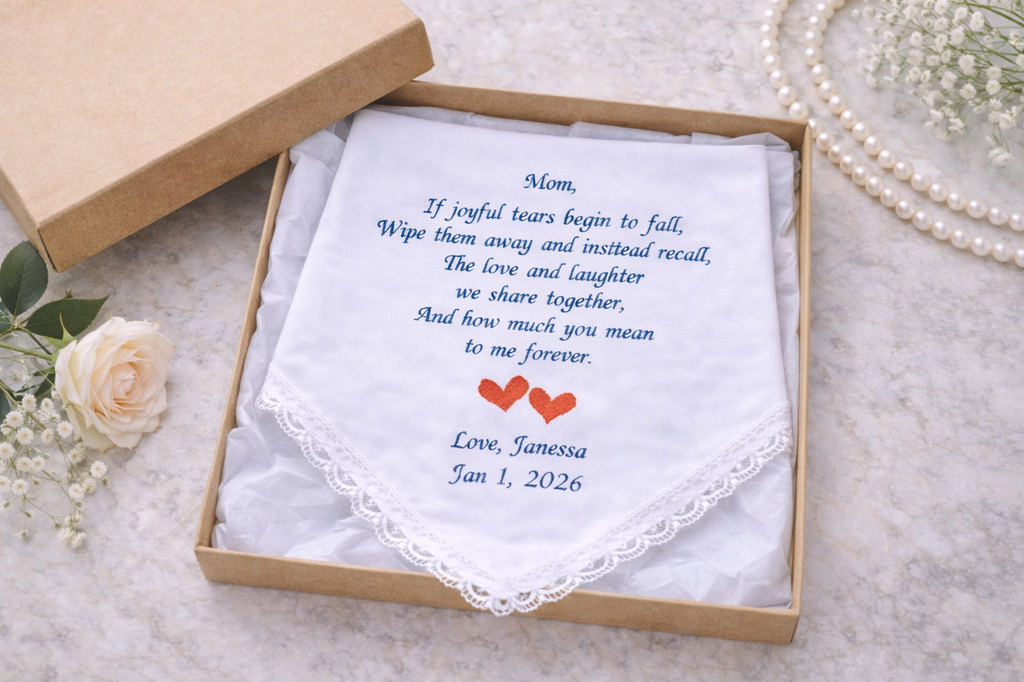 Embroidered handkerchief with a message and dates for mom on a light background