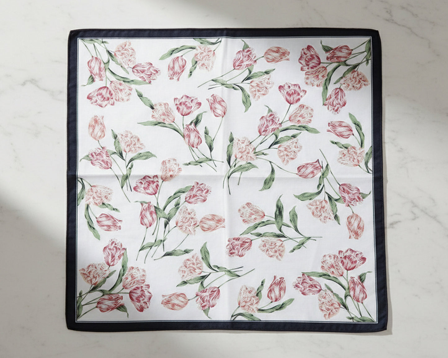 Floral patterned fabric square handkerchiefs on a light background