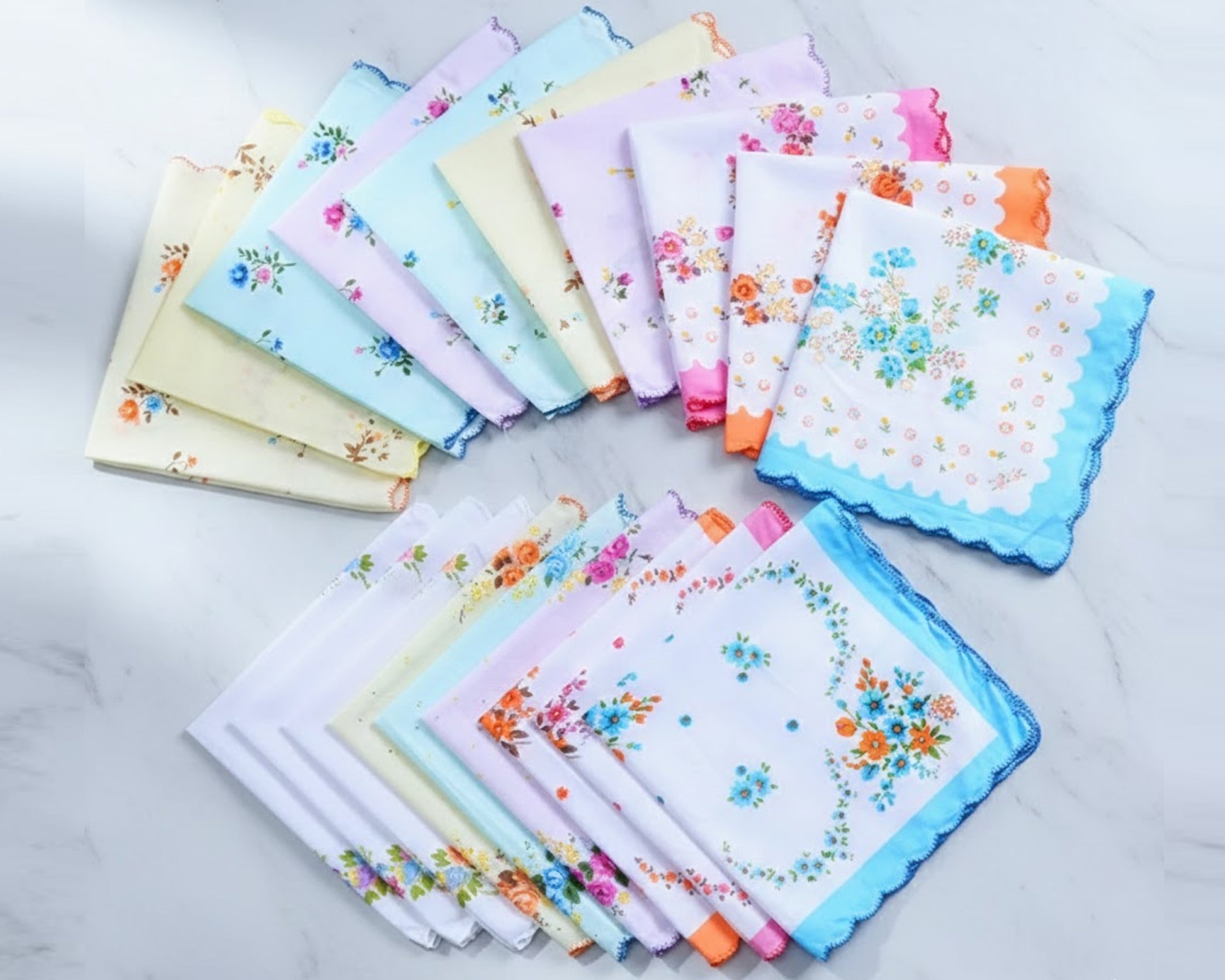 Set of floral handkerchiefs in various colors on a light background