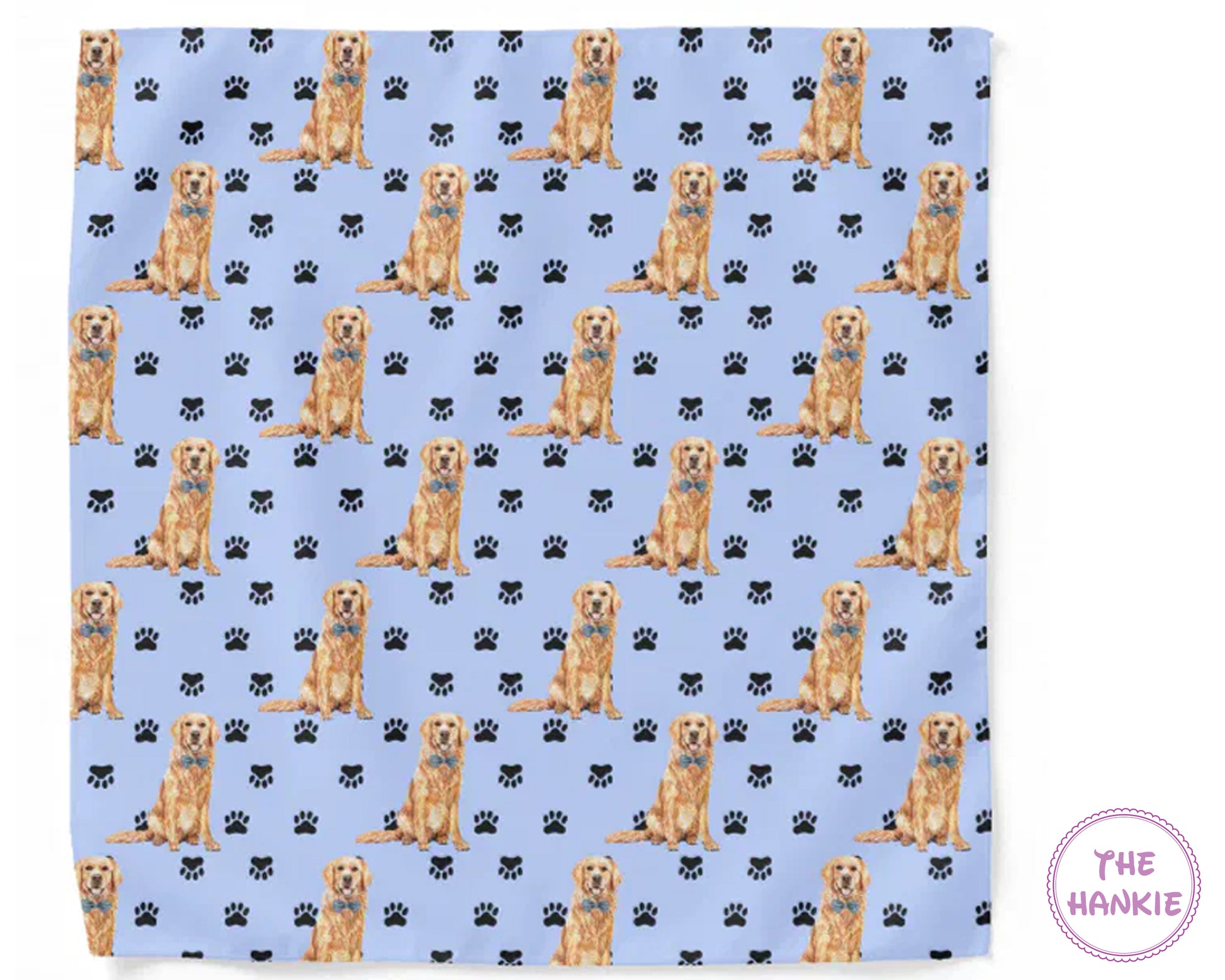 Patterned hankie with dogs and paw prints on a blue background, featuring the brand 'The Hankie'.