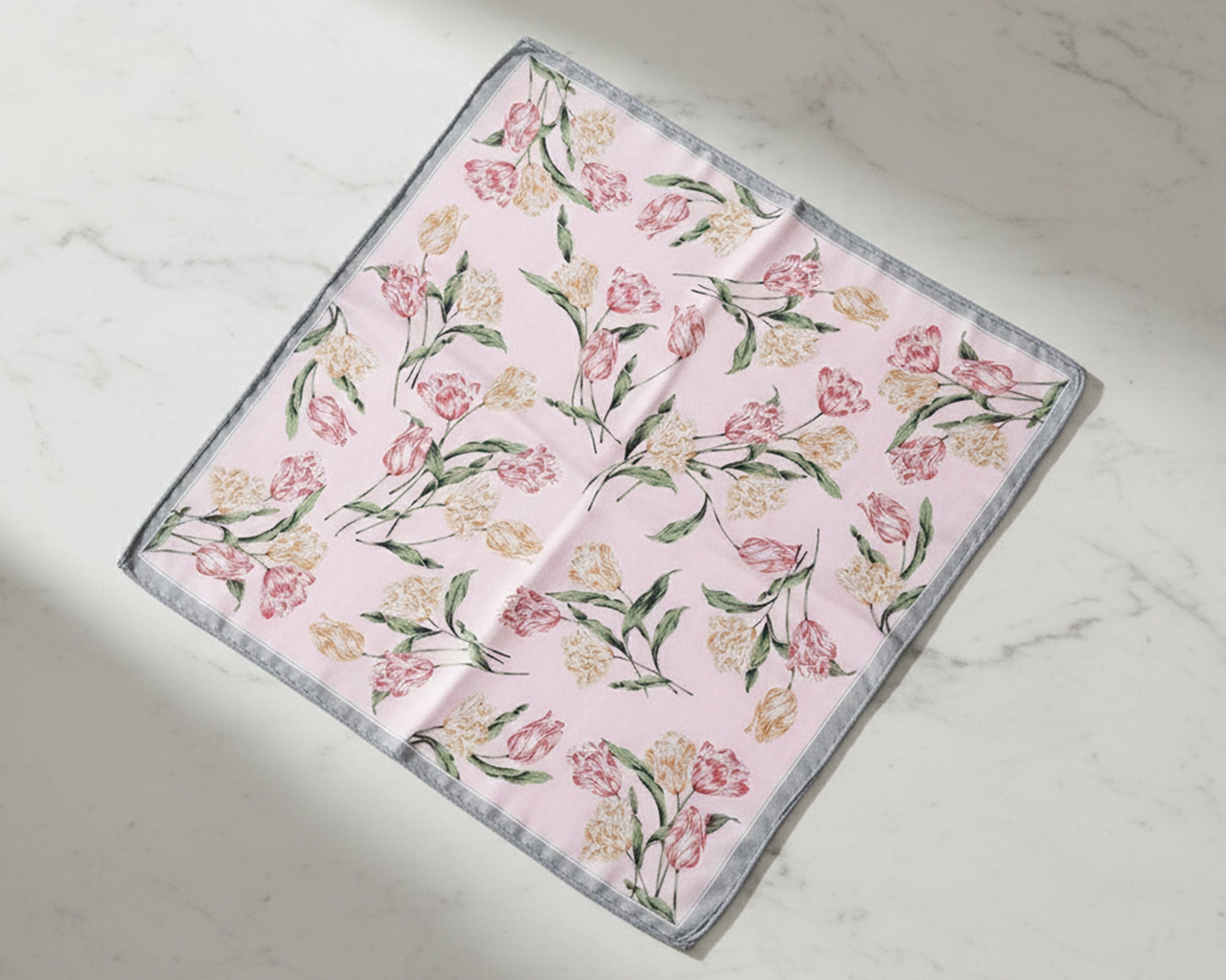 Floral patterned fabric on a marble surface