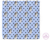 Patterned towel with husky dogs and paw prints on a blue background, branded 'The Hankie'.