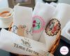 Set of embroidered napkins with coffee and tea designs in a basket.