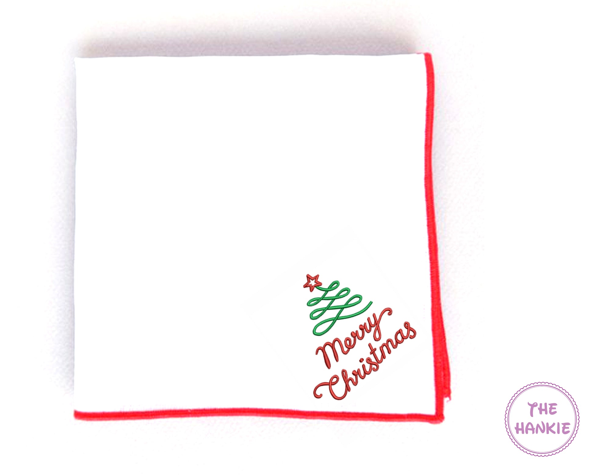 White hankie with red border and embroidered Christmas tree design, featuring the text 'Merry Christmas'.