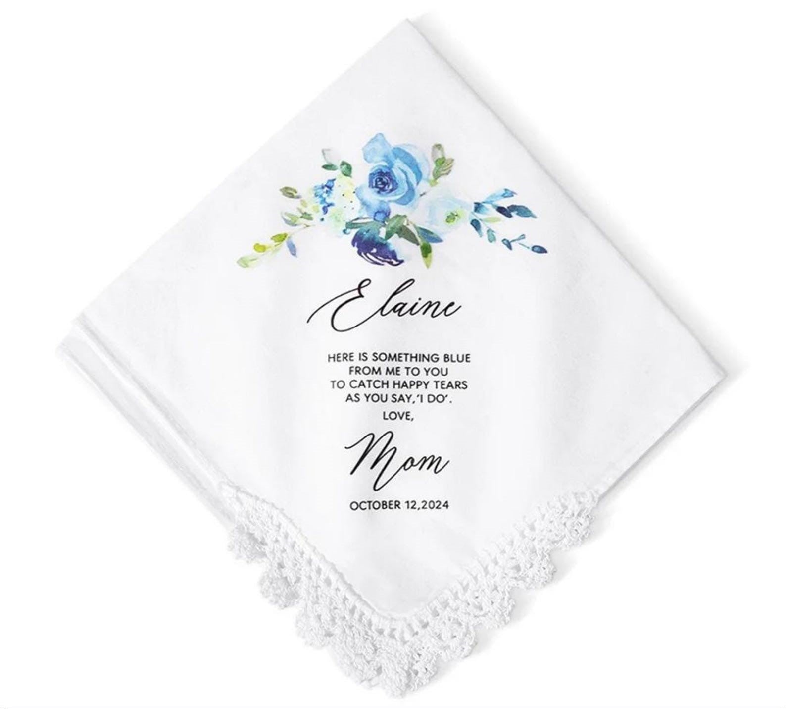 White handkerchief with floral design and personalized text on a white background