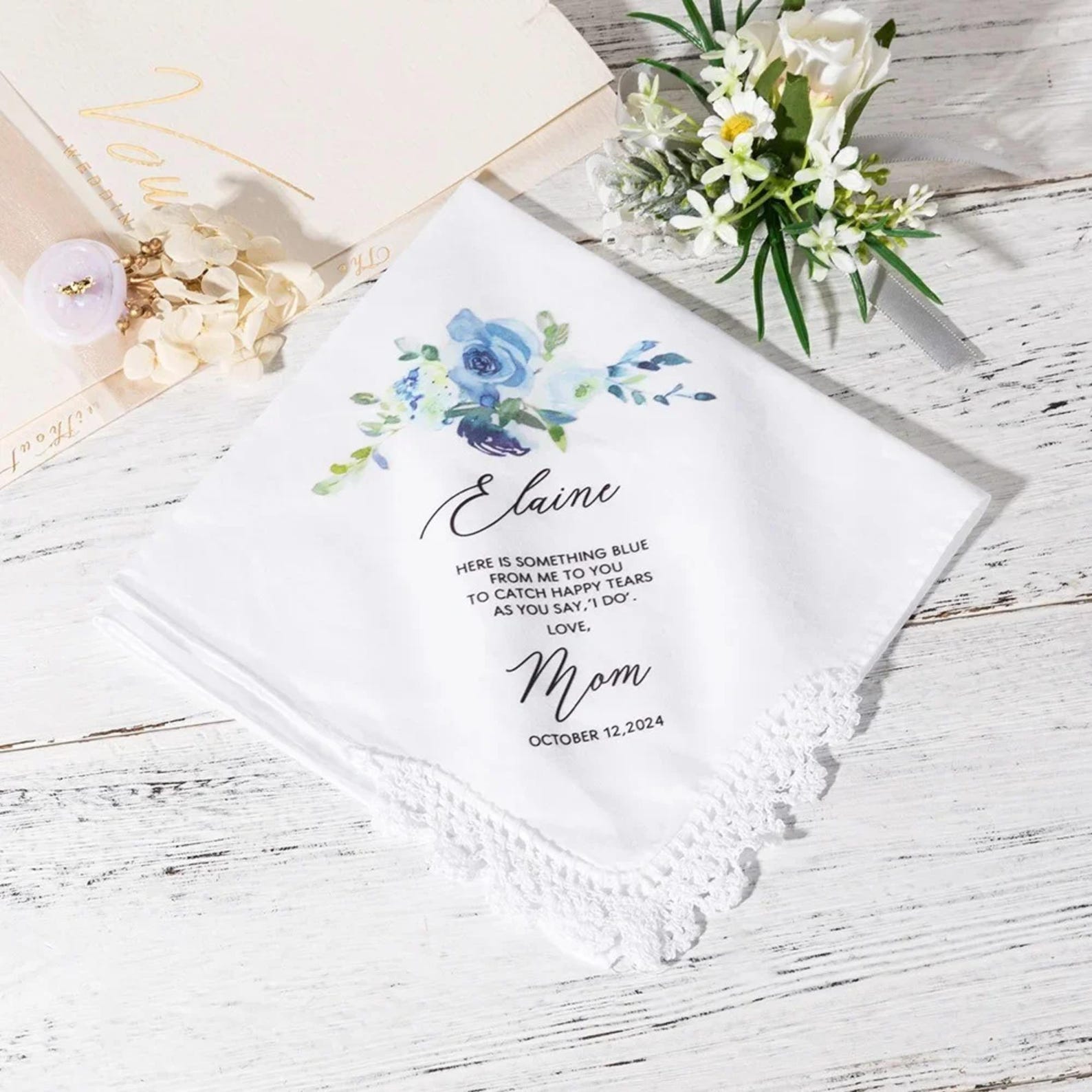 Personalized handkerchief with floral design and text on a wooden surface