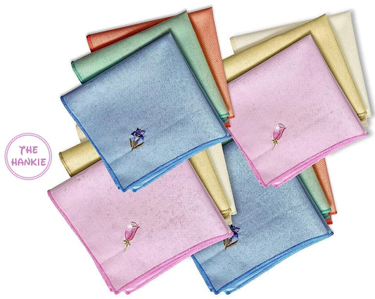 Collection of colorful hankies with floral embroidery branded 'The Hankie'.