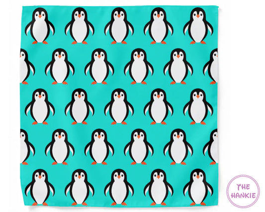 Teal hankie with penguin pattern and 'The Hankie' branding