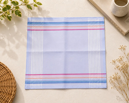 Placemat with colorful stripes on a light surface with decorative elements