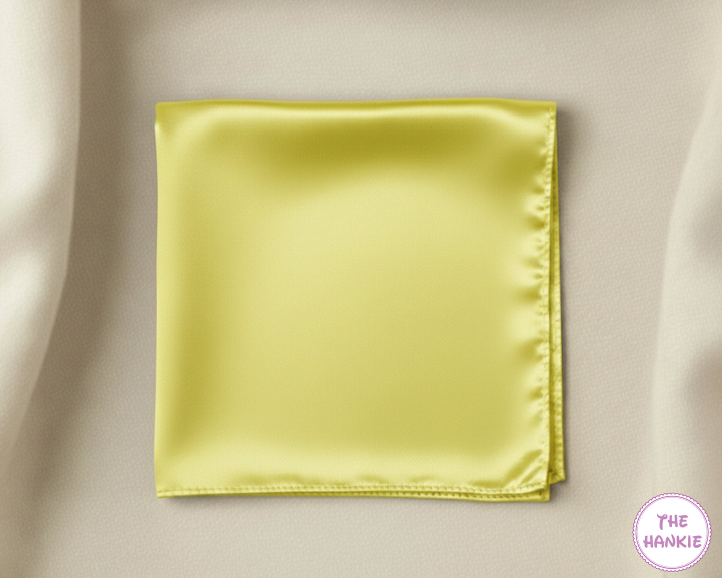 Yellow satin hankie on a beige background with 'The Hankie' brand logo.