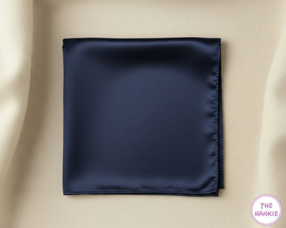 Navy blue satin hankie on a beige background with 'The Hankie' brand logo.