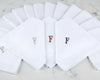 Set of white handkerchiefs with embroidered letters 