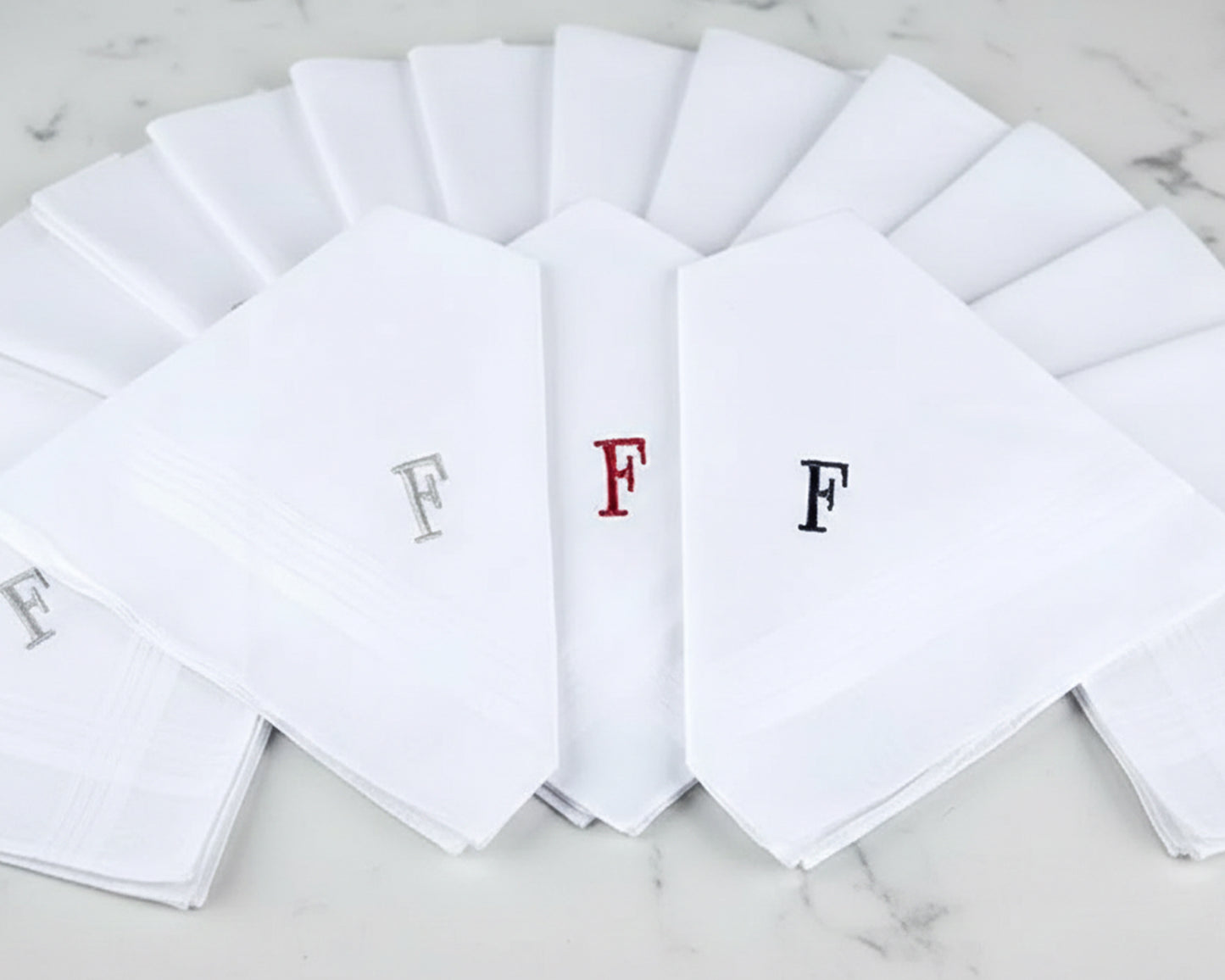 Set of white handkerchiefs with embroidered letters 