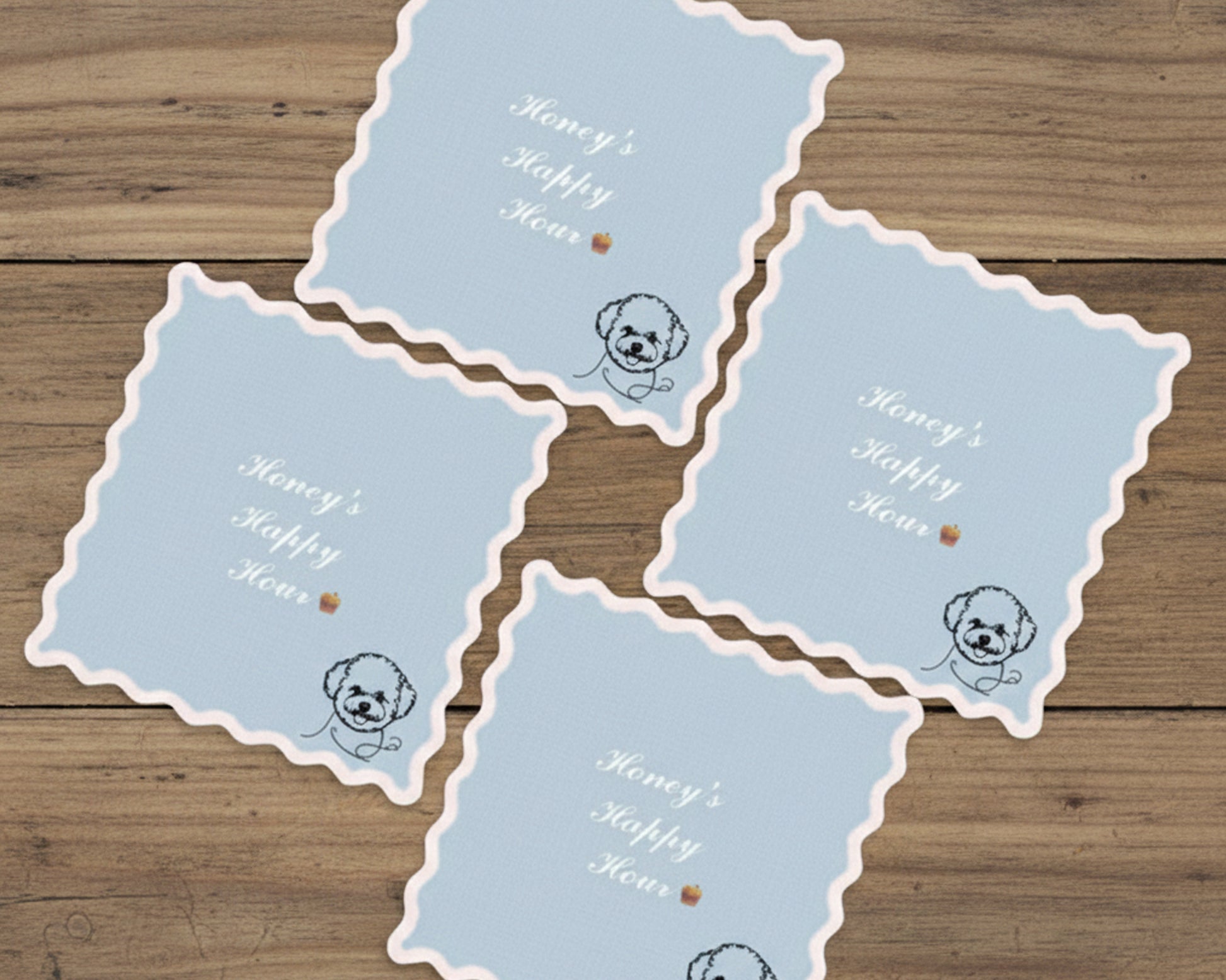 Set of blue cards with dog illustrations and text on a wooden surface