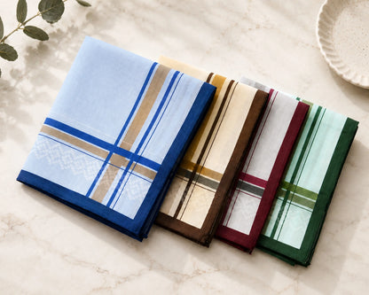 Set of four plaid stripe hanky in different colors on a marble surface.