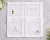 Set of four white napkins with personalized designs on a marble surface.
