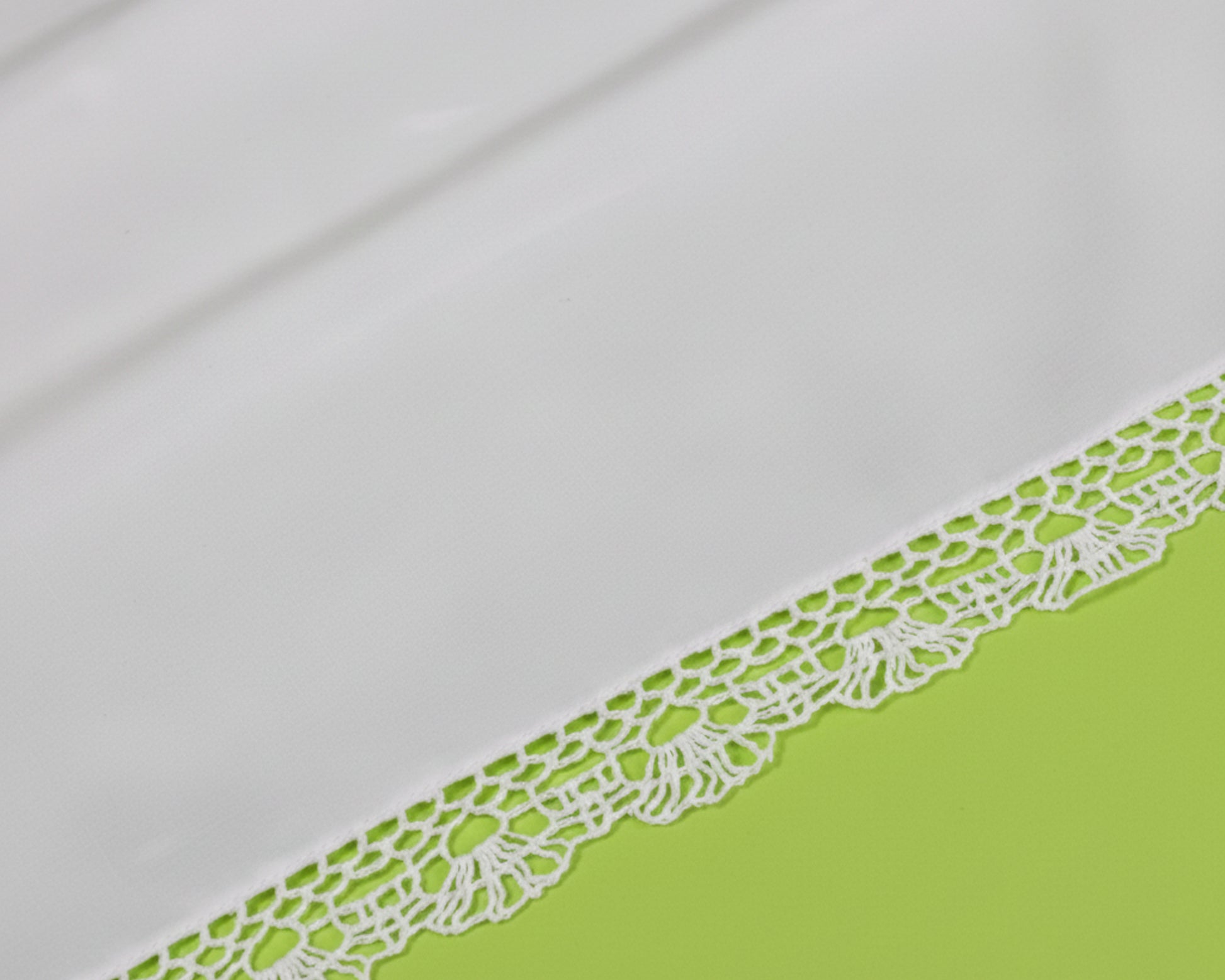 Full square view of a white cotton bridal handkerchief featuring a wide floral lace edge.