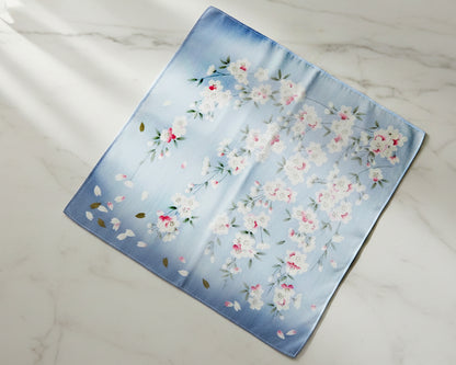 Floral patterned fabric handkerchief on a marble surface
