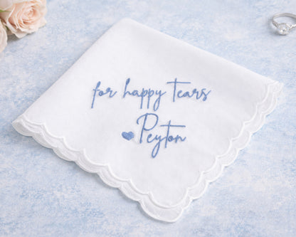 White handkerchief with blue text 'for happy tears Peyton' on a light blue background