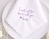 White handkerchief with purple text on a white plate