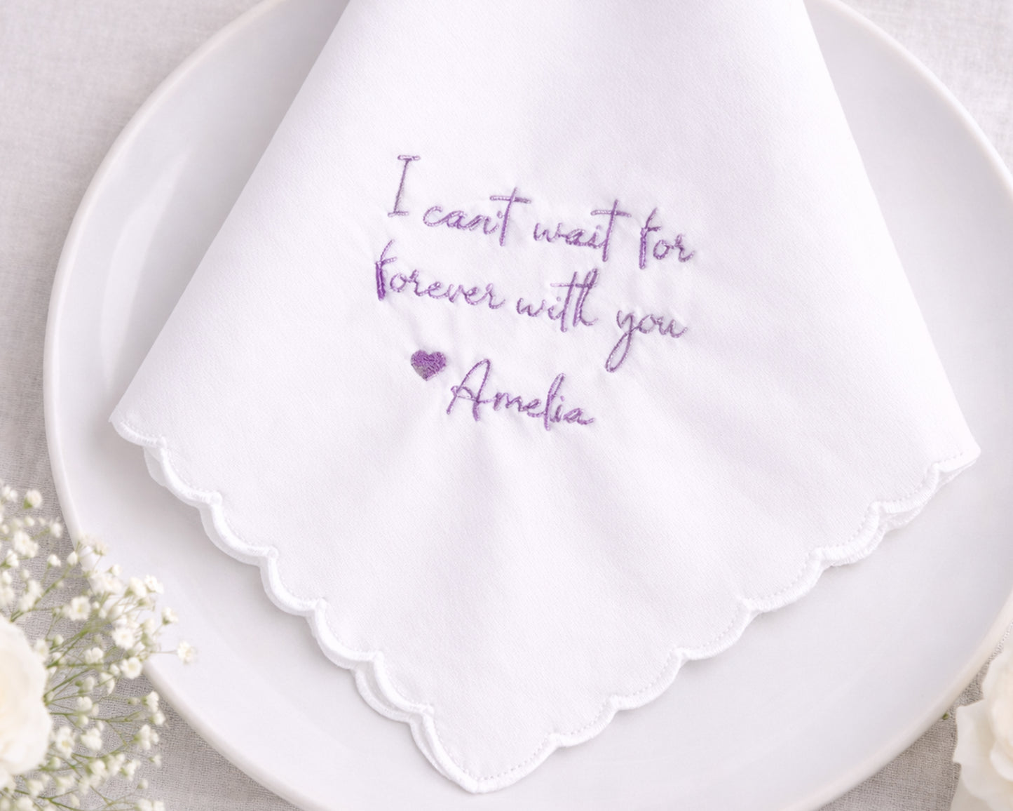 White handkerchief with purple text on a white plate