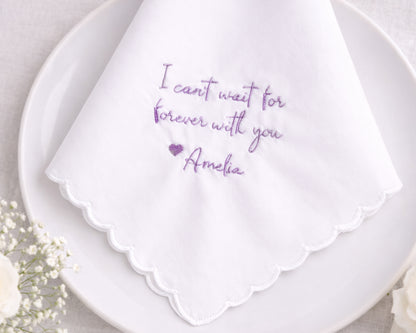 White handkerchief with purple text on a white plate