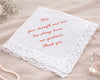 White handkerchief with red text on a beige surface