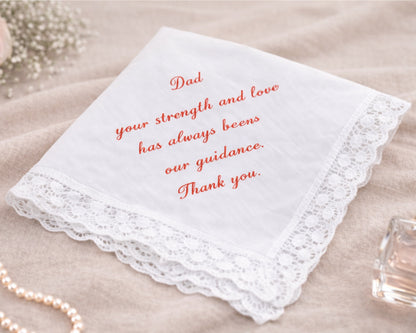White handkerchief with red text on a beige surface
