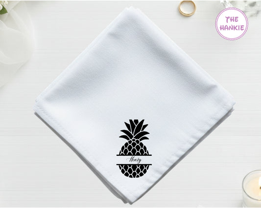 White hankie with black pineapple design and 'Flory' text on a light background.