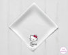 White napkin with Hello Kitty logo and 'Laura' text on a light wooden surface, branded 'The Hankie'.