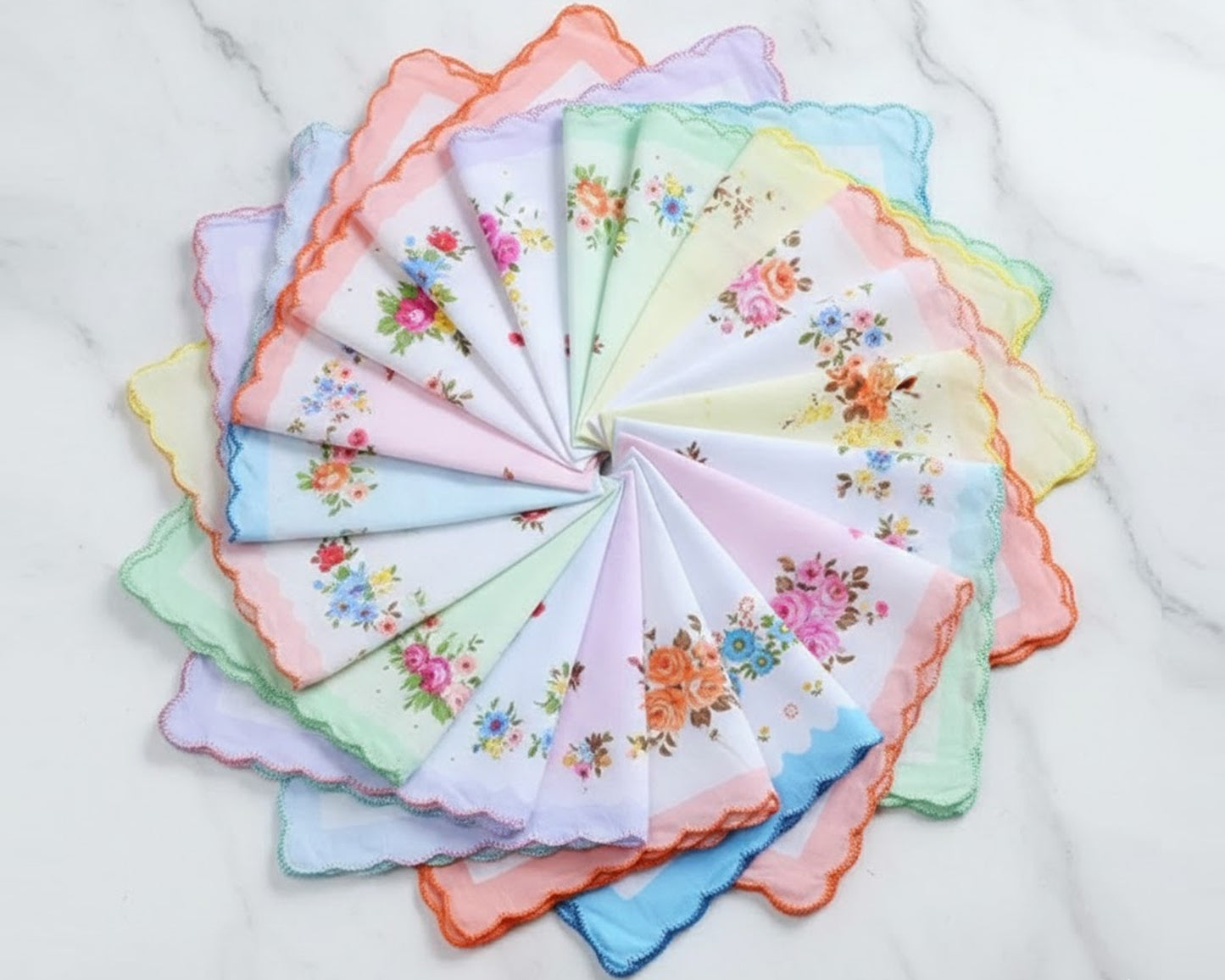 Circular arrangement of floral handkerchiefs in various colors on a white background