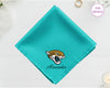 A vibrant turquoise cotton handkerchief customized with "Alexander" below a detailed vinyl print of the Jacksonville Jaguars NFL team logo.