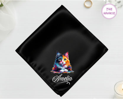 A midnight onyx black high-lustre satin pocket square customized with "Amelia" and a high-definition painterly multi-colored cat portrait.