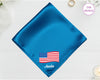 A brilliant sapphire blue satin handkerchief featuring "Amelia" and a detailed, waving American flag embroidery.