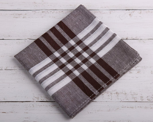 A group of assorted plaid and striped cotton handkerchiefs showcasing various blue and earth tone patterns.