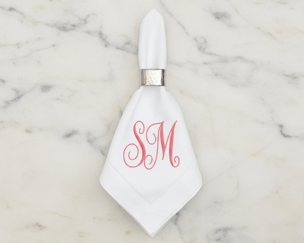 Custom embroidered cotton napkin with pink classic SM monogram on white fabric
