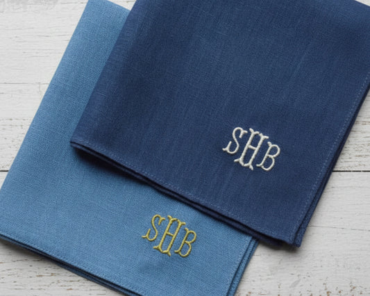 Two 100% premium cotton pocket squares in crisp white and deep navy, featuring custom three-letter "SHB" monogram embroidery in a classic serif font.