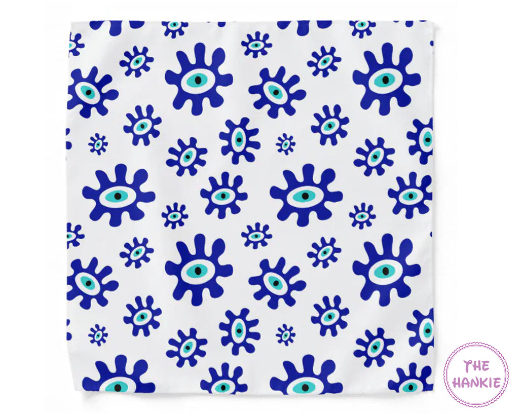 White hankie with blue and green eye pattern, branded 'The Hankie'.